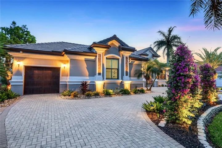 front/side of property with large circle drive. Integrated security video cameras at every entry.