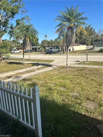 View of yard featuring fence