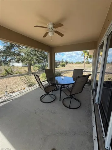 View of patio featuring ceiling fan and outdoor dining space