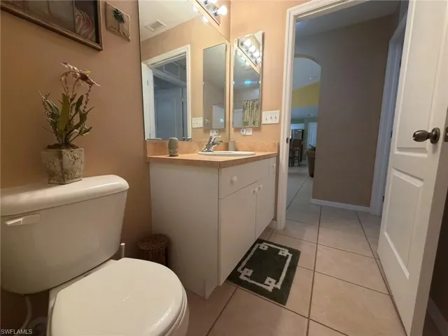 Bathroom featuring light tile patterned floors and vanity