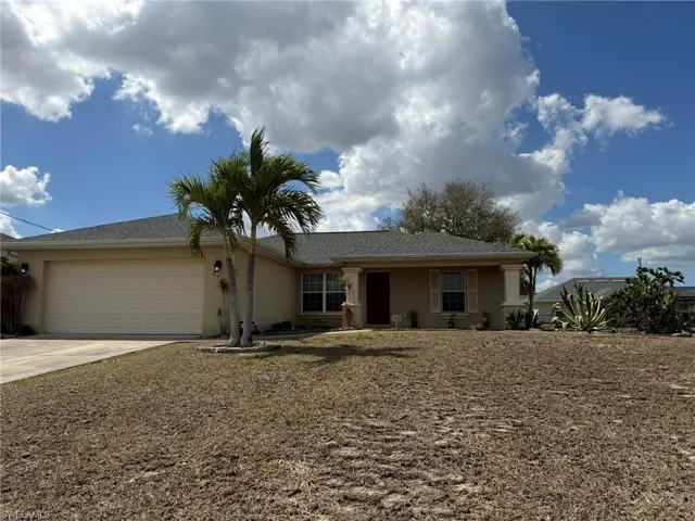 Single story home featuring an attached garage, stucco siding, concrete driveway, and roof with shingles