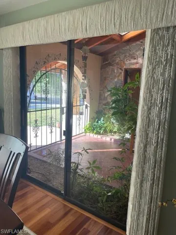 Entryway with hardwood / wood-style floors