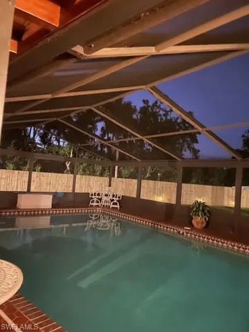 View of swimming pool with screen enclosure