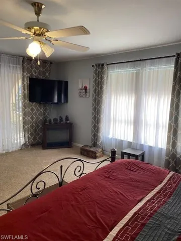 Bedroom featuring carpet flooring and ceiling fan
