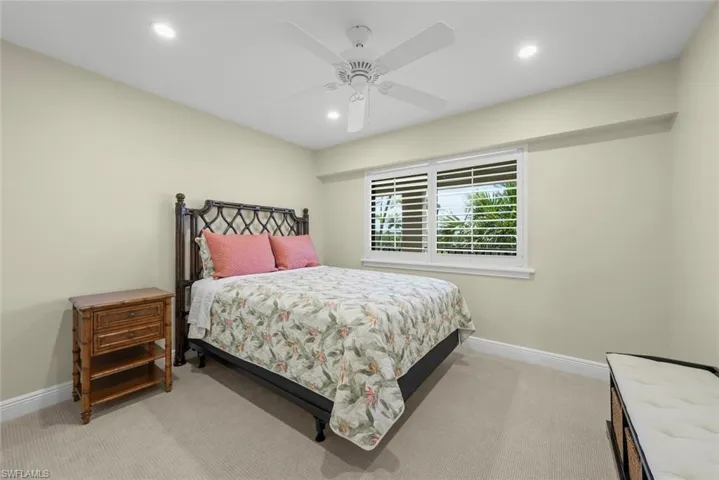 Bedroom featuring plush carpet, recessed lighting, and a ceiling fan