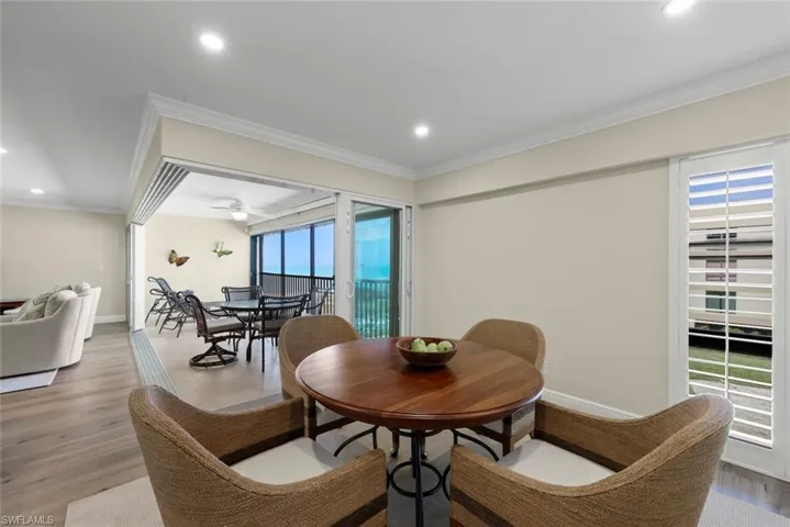 Dining area featuring a round wood table and four woven chairs