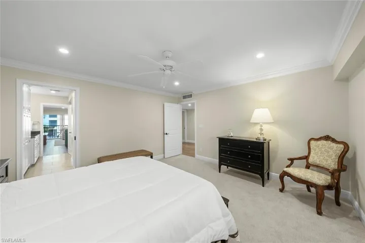Carpeted room featuring crown molding, recessed lighting, and a ceiling fan