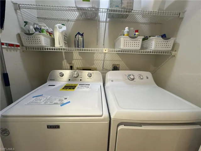 Laundry room featuring separate washer and dryer