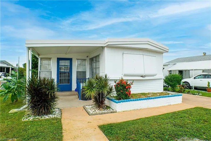 View of front of house with a front yard