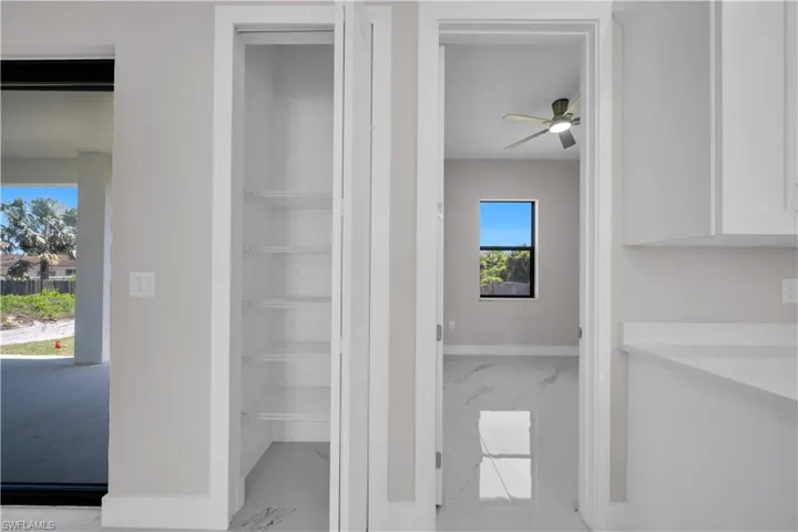 Open pantry with multiple shelves