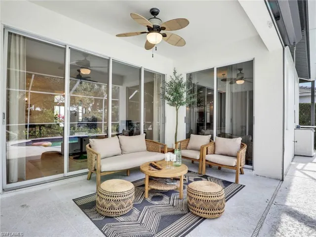 View of patio with an outdoor living space and a ceiling fan