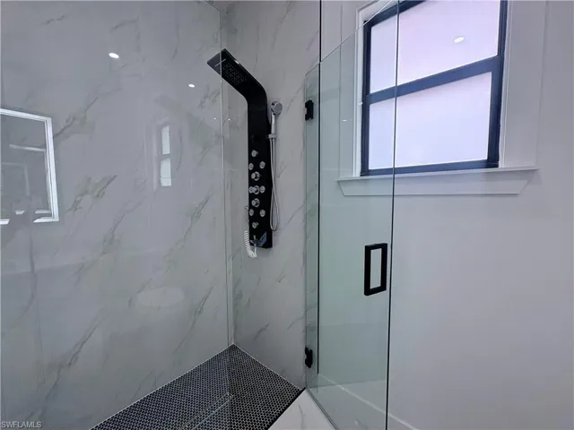 Bathroom featuring walk in shower