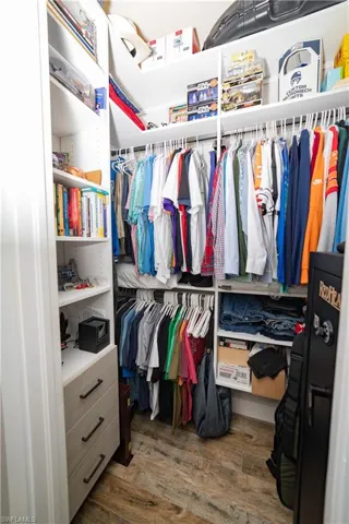 Spacious closet with wood finished floors