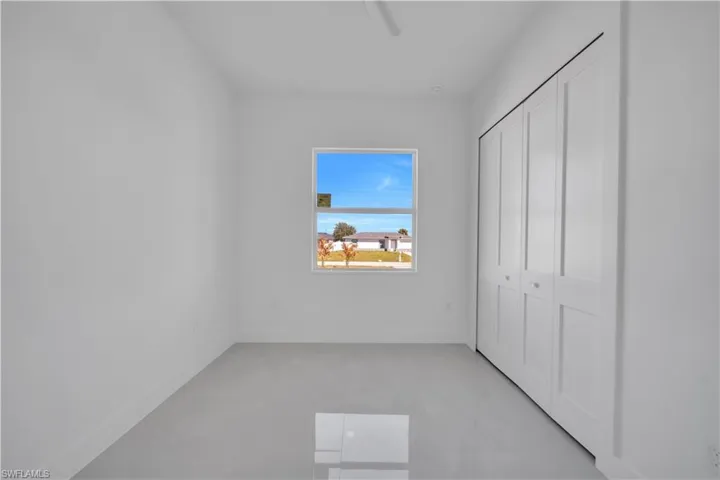 Unfurnished bedroom with a closet and a ceiling fan
