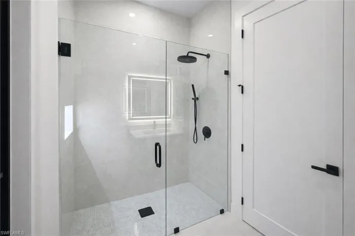 Bathroom featuring a shower stall