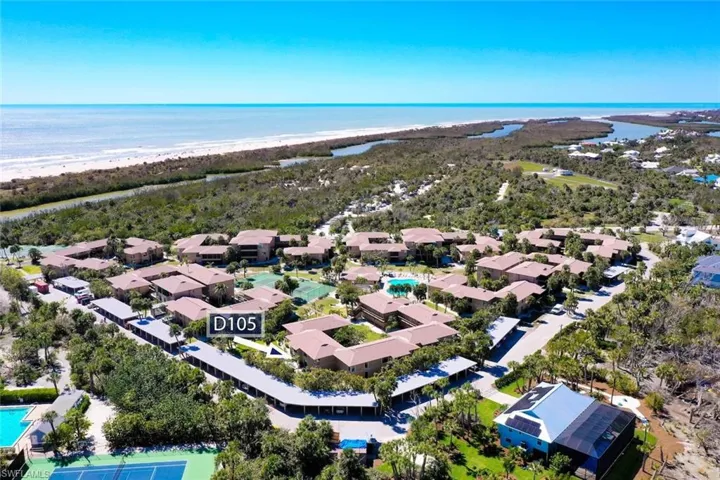 Aerial view featuring a view of the beach and a water view