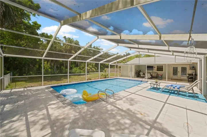 Screened in pool with sunning area