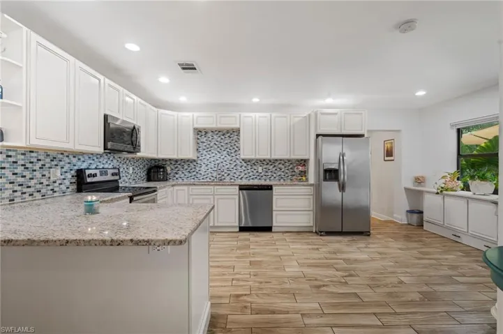 Kitchen featuring pensula counter space.