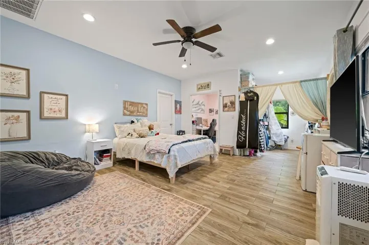 This room is 14X23 large.  It has 2 closets and large windows all across one wall with view of garden/landscaped area. separate entrance also.