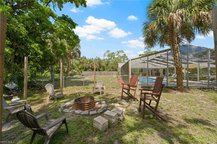 View of yard with a fire pit