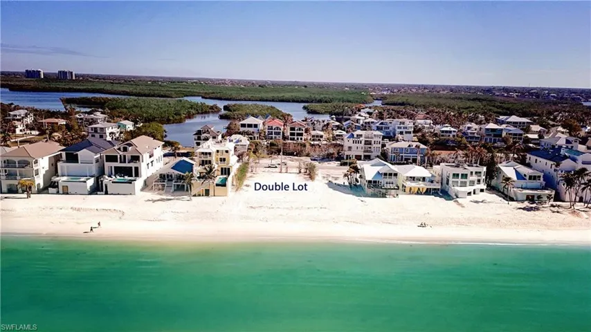 EXPANSIVE 100 FT BEACHFRONT LOT, WITH ACCESS DIRECTLY ACROSS STREET TO 100 FT BAYSIDE LOT.