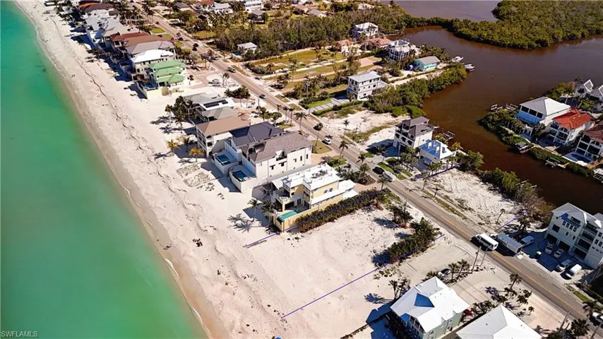 Aerial view of residential area with unending shoreline
