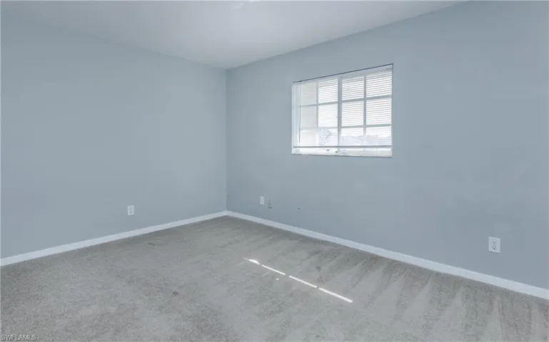 Unfurnished room featuring carpet flooring