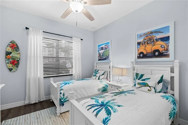 Bedroom with ceiling fan and light wood-type flooring
