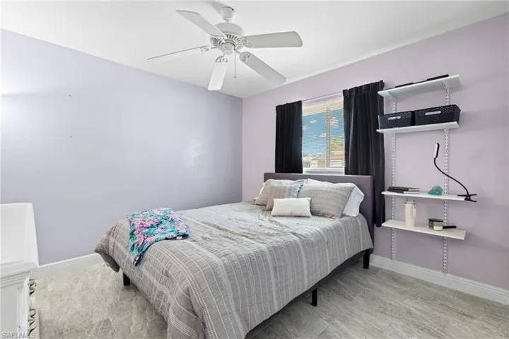 Bedroom with wood-type flooring and ceiling fan