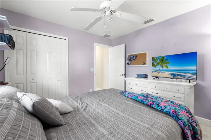 Bedroom with a closet and ceiling fan