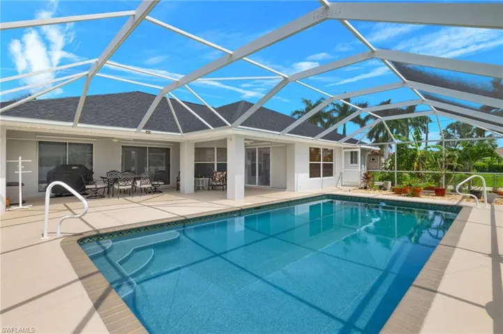 View of pool featuring a patio, a lanai, and grilling area