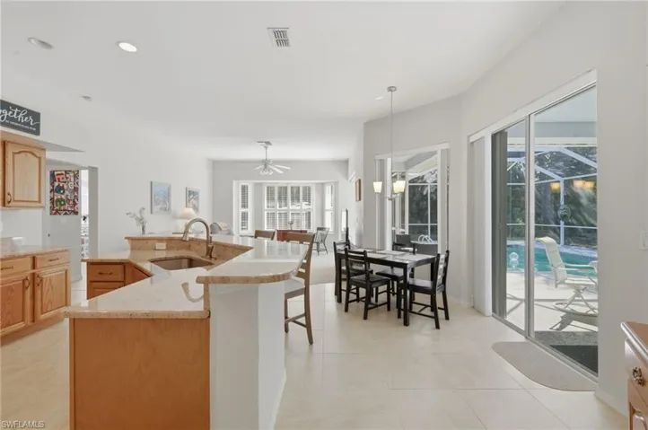Kitchen opens to Family Room and Sliders to Lania.