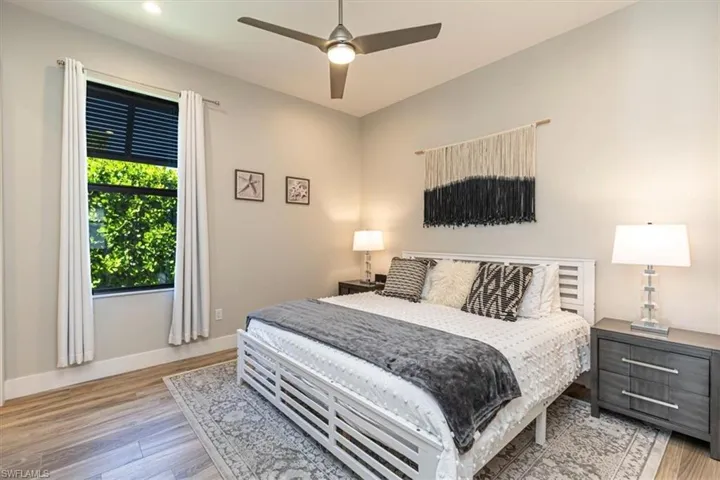 Bedroom featuring light wood-style floors and a ceiling fan