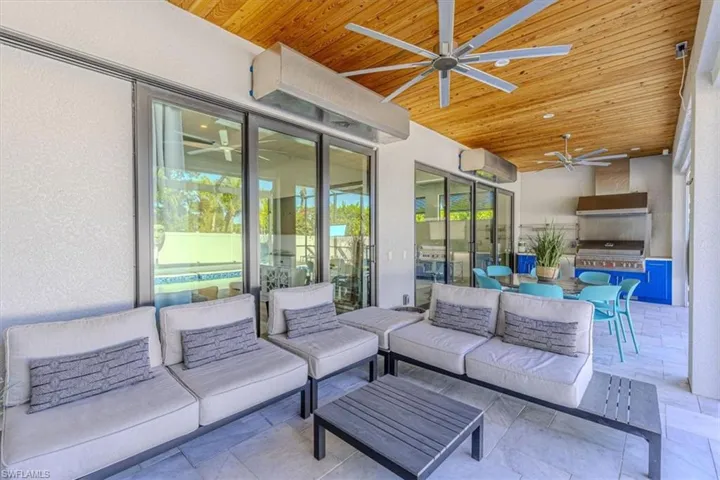 View of patio / terrace with ceiling fan, exterior kitchen, an outdoor hangout area, and outdoor dining area