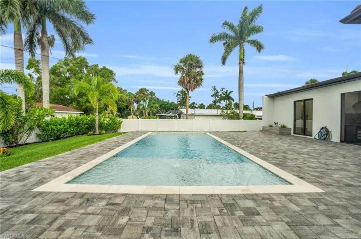 View of swimming pool with a patio area