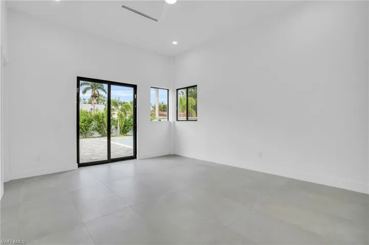 Empty room with light tile flooring