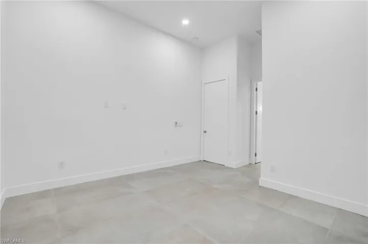 Spare room featuring light tile floors
