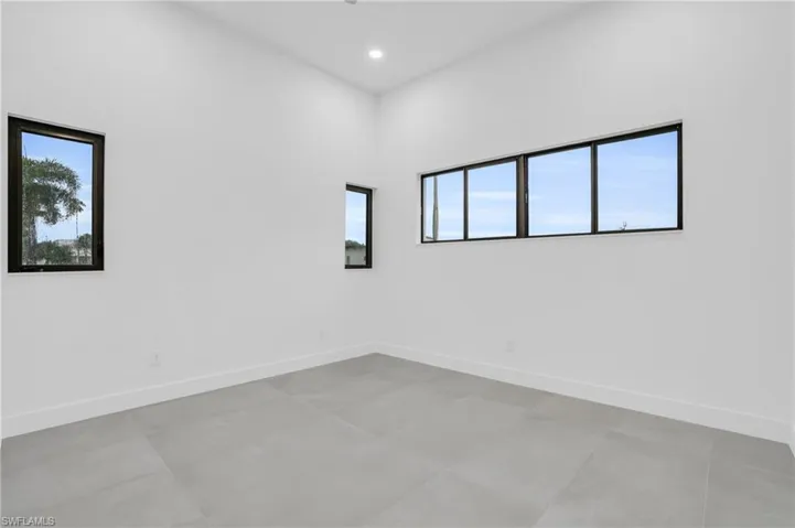 Tiled empty room with a wealth of natural light