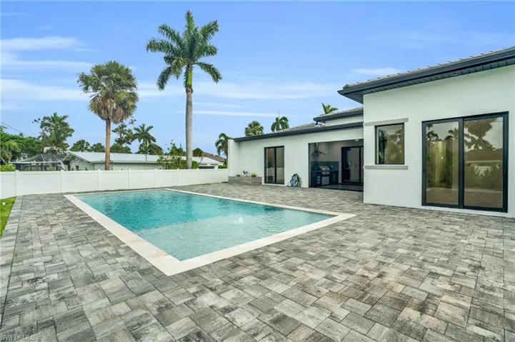 View of pool featuring a patio area and pool water feature
