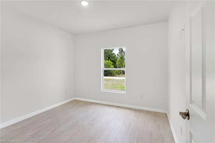 Spare room featuring light hardwood / wood-style flooring