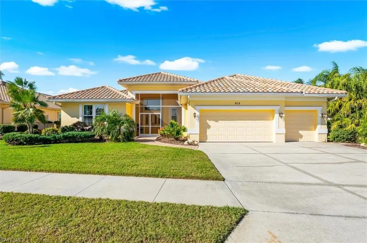 Mediterranean / spanish house with stucco siding, a front yard, a garage, concrete driveway, and a tile roof