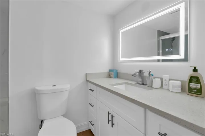 Bathroom featuring vanity and light wood-style flooring