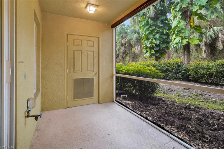 Extra storage off of lanai with wooded view