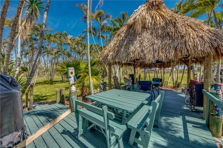 Wooden deck featuring a gazebo