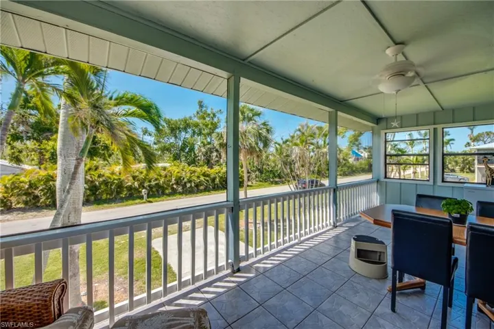 Sunroom with ceiling fan and a healthy amount of sunlight