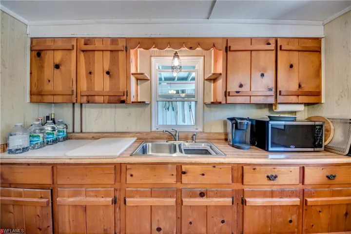 Kitchen with sink and ornamental molding