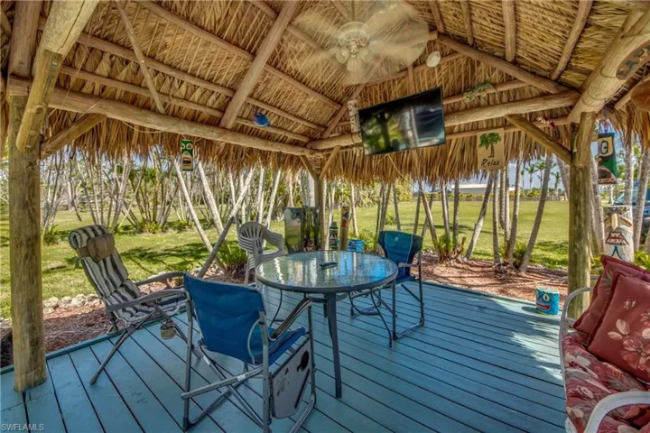 Wooden deck with a yard and a gazebo