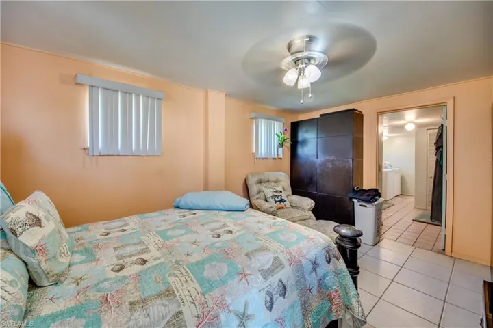 Bedroom featuring ceiling fan and light tile patterned flooring