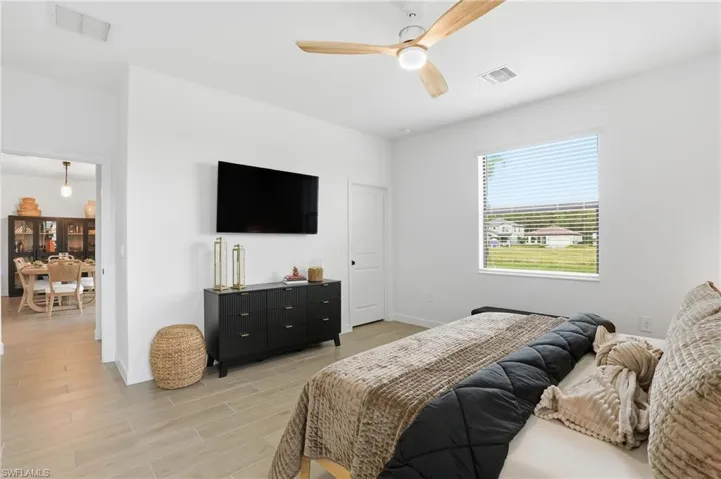 Bedroom featuring wood finish floors and ceiling fan