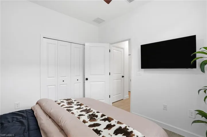 Bedroom featuring a closet and a ceiling fan